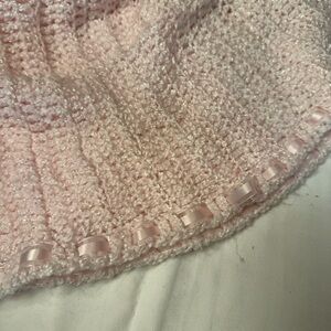 Pink Knitted Blanket with Ribbon Trim on one end.  Pale baby pink. Ever so soft